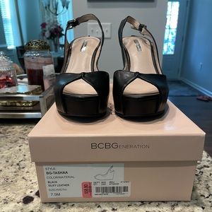 Black silky leather BCBGeneration “Tashaa” wedge.